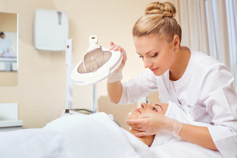 female dermatologist examining patient