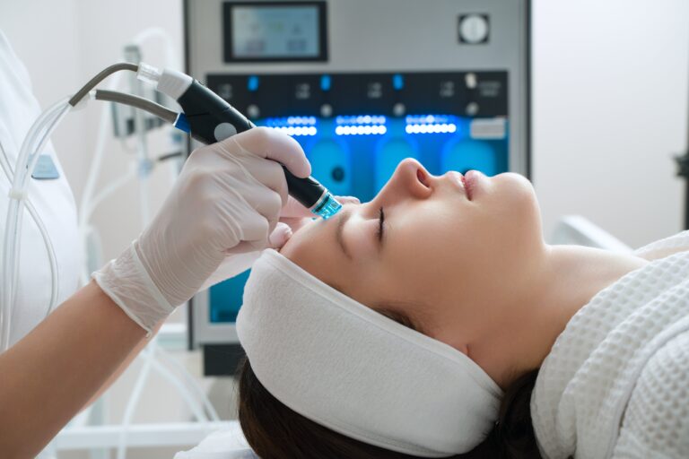 a woman is recieving laser dermatology by a professional